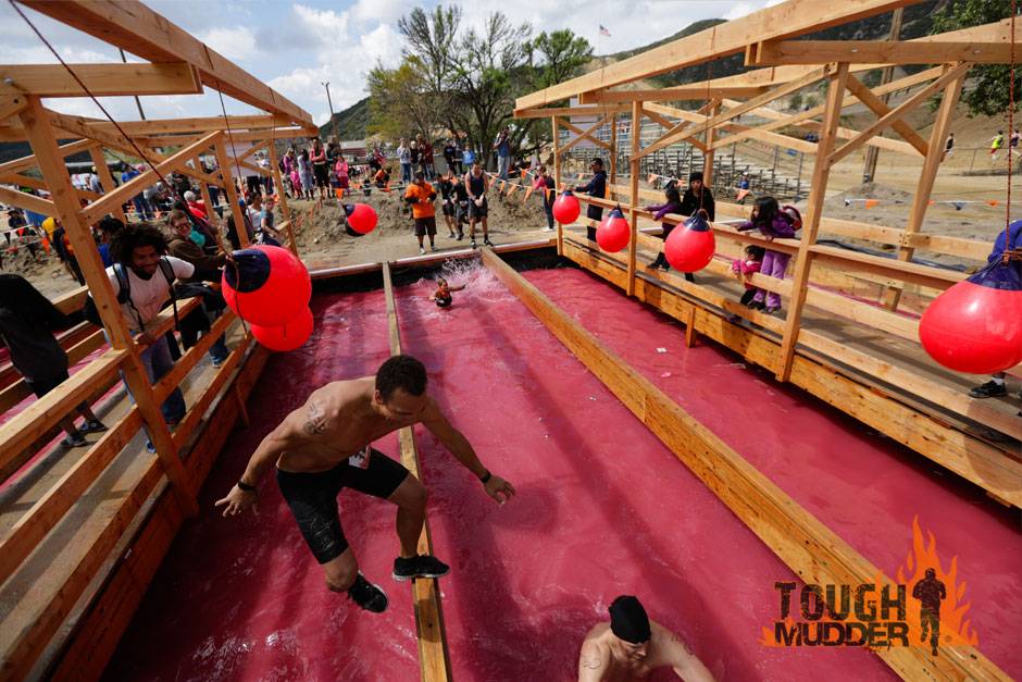  Getting knocked down by spectators during the Family Feud obstacle. &nbsp;This actually looks like fun!&nbsp; 